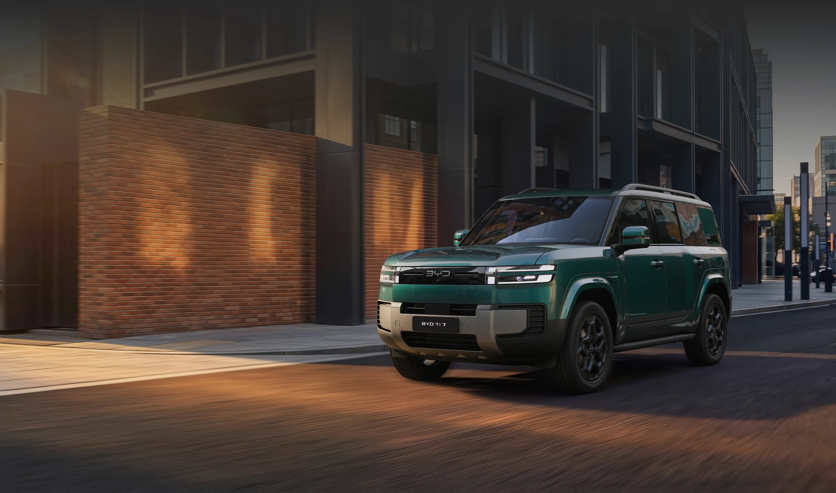 Teal BYD Ti7 SUV parked on a modern urban street