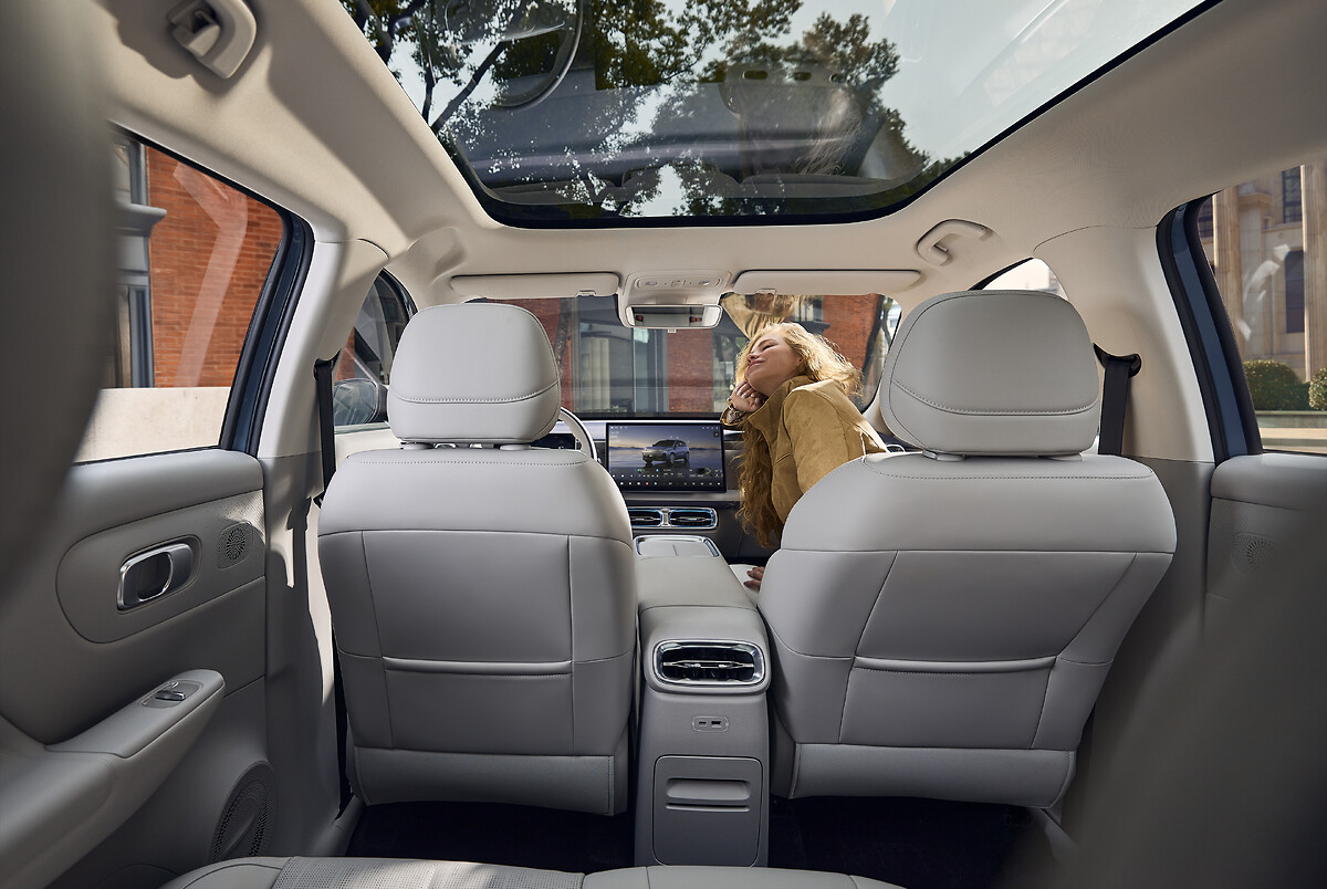 Leapmotor B10 interior cabin view showing front and rear seats with panoramic sunroof
