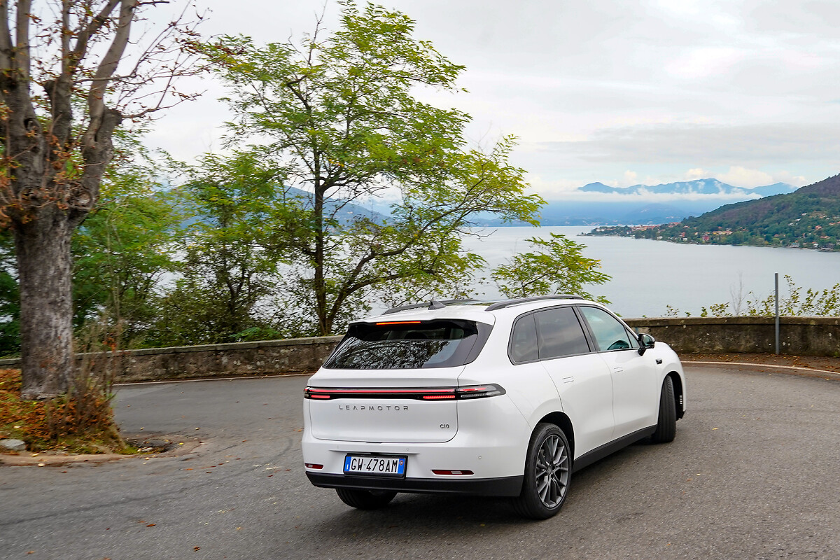 Leapmotor C10 white SUV parked by lake showing sleek rear LED taillights