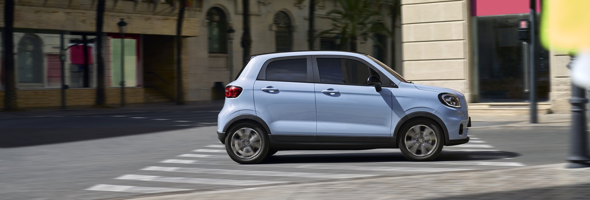 Light blue Leapmotor T03 side profile parked on an urban street