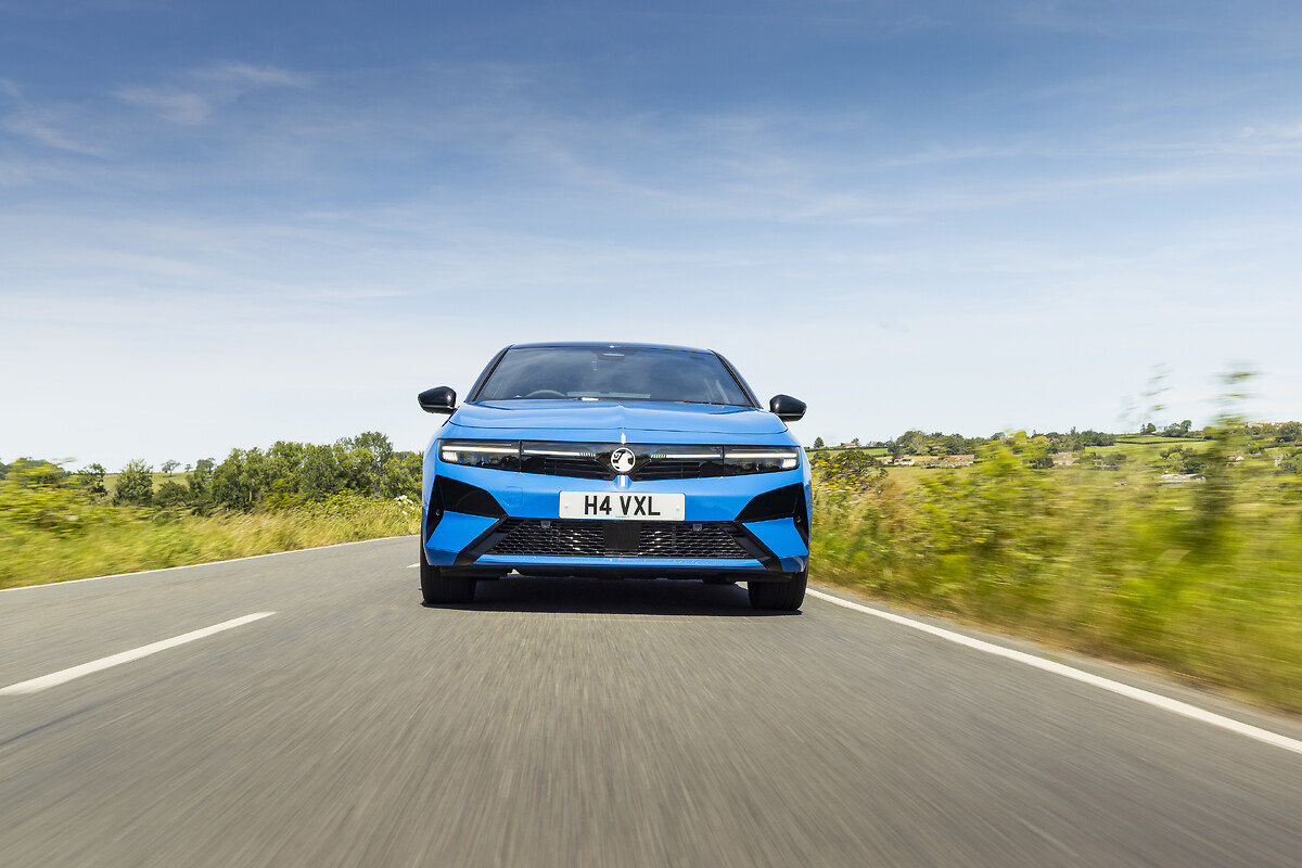 Blue Vauxhall Astra rear view driving on highway