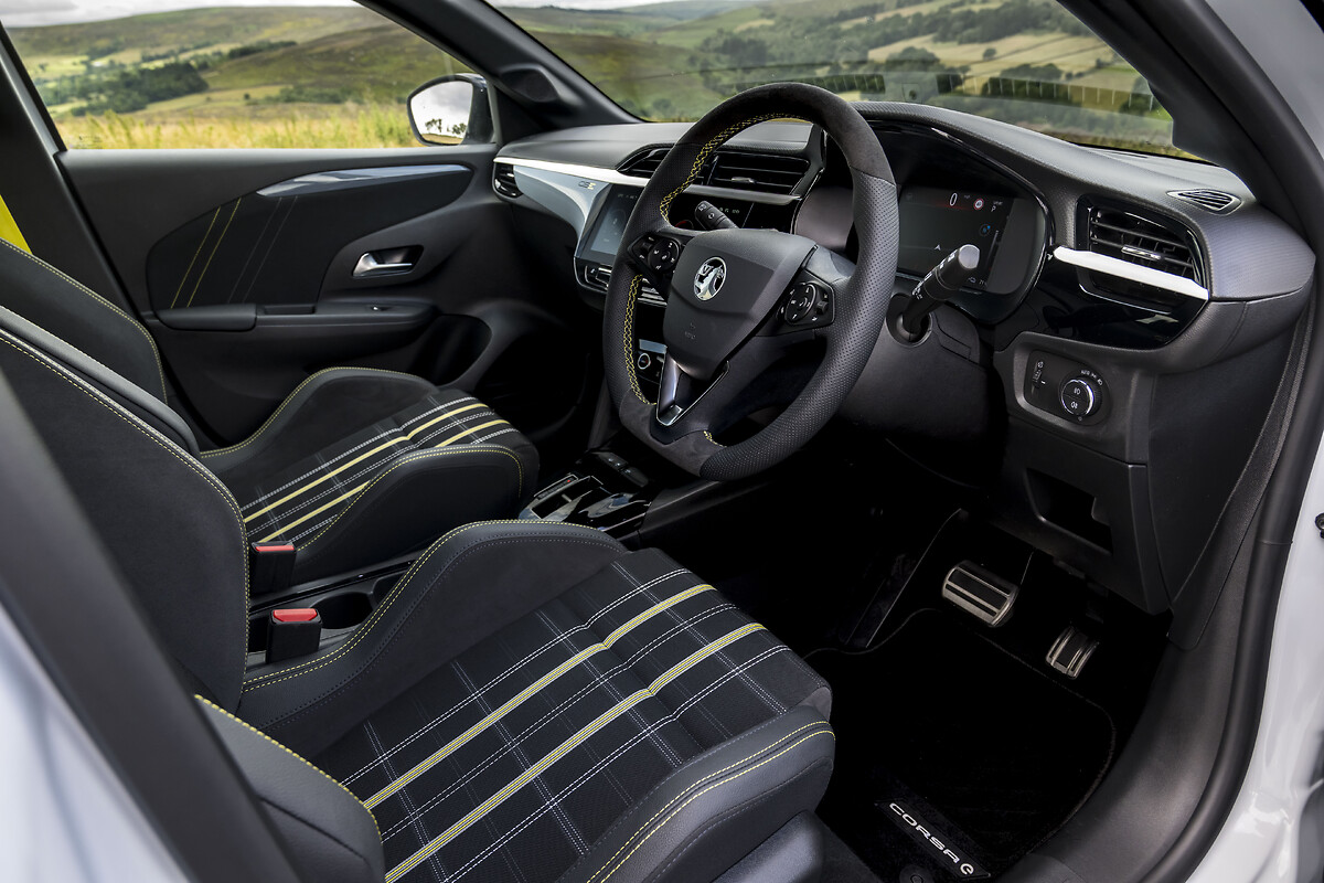 White Vauxhall Corsa interior seats and dashboard view
