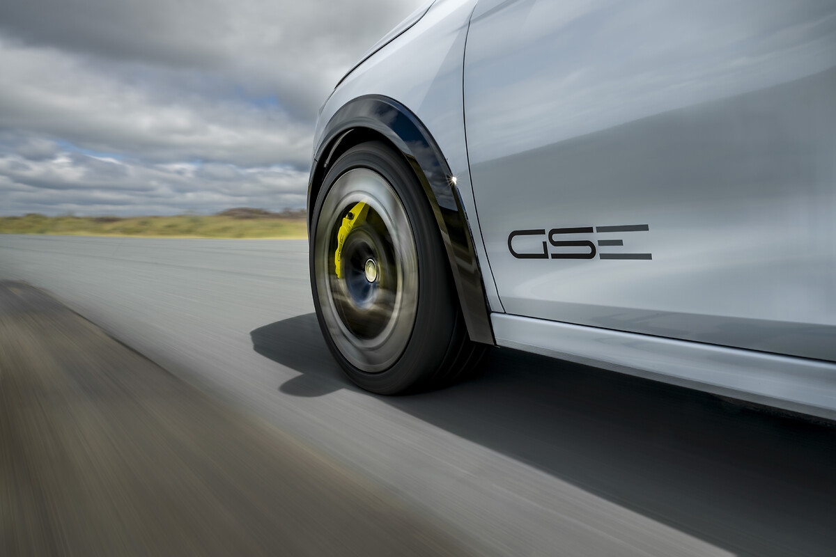 White Vauxhall Corsa wheel with yellow brake caliper