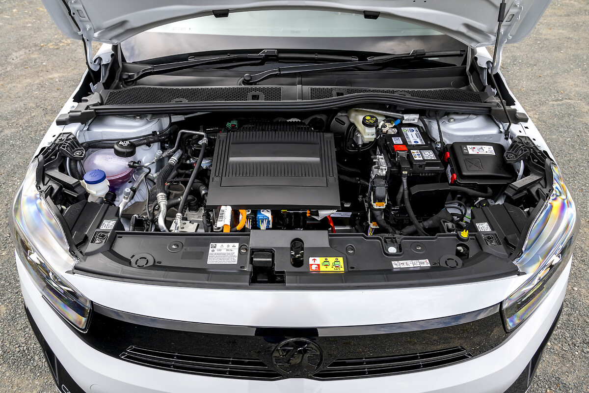 White Vauxhall Corsa open bonnet showing engine bay