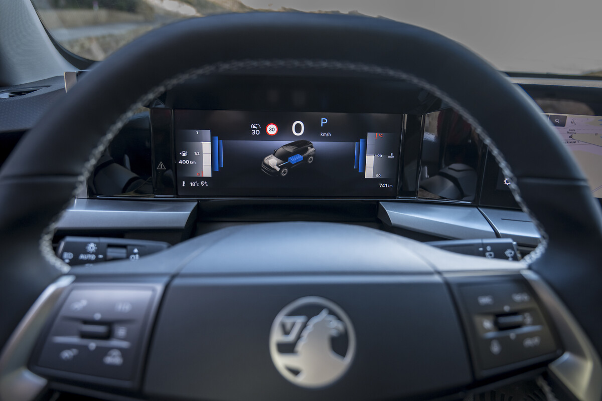 Digital instrument cluster showing vehicle status and speed