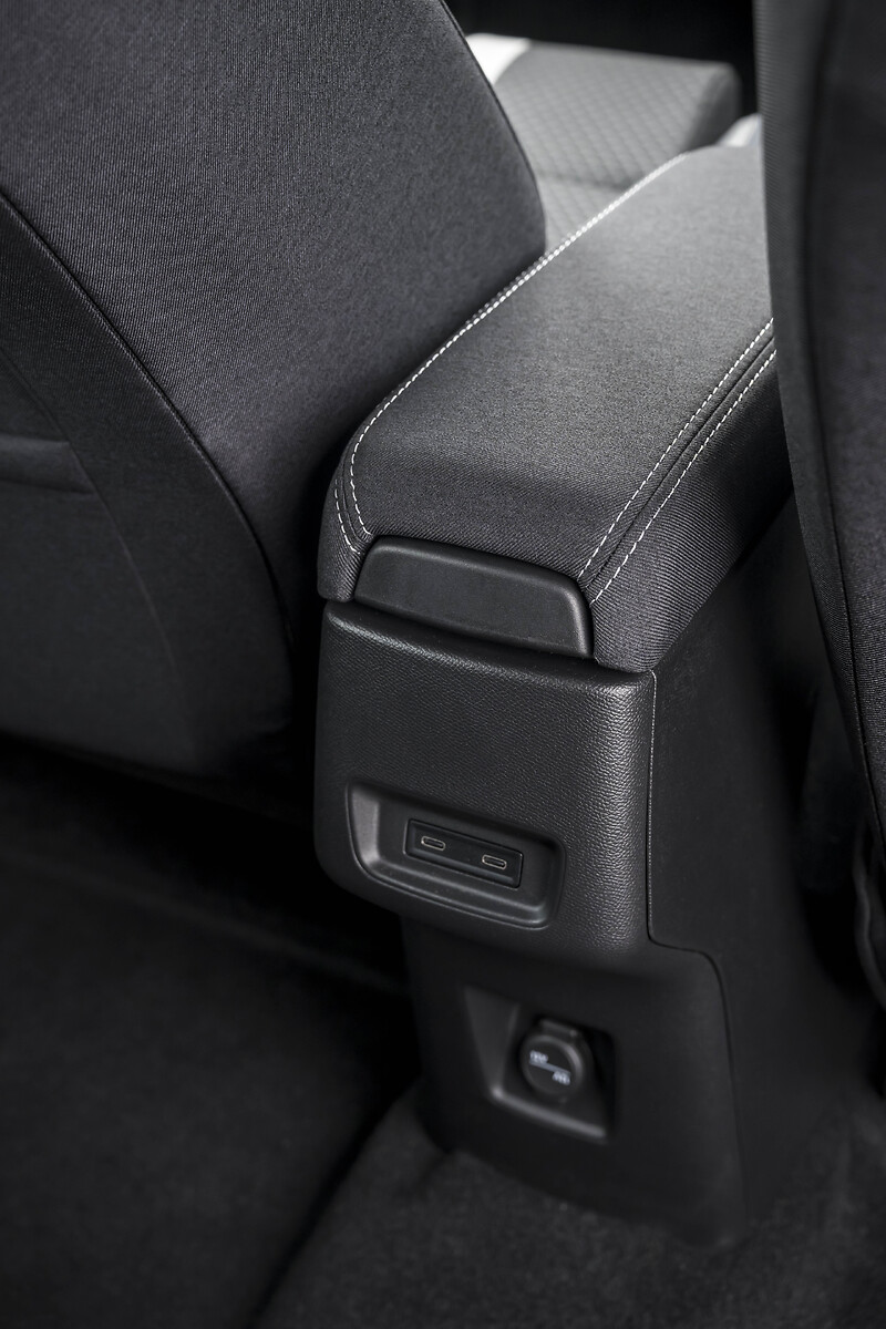 Close-up of centre armrest and seat fabric detail