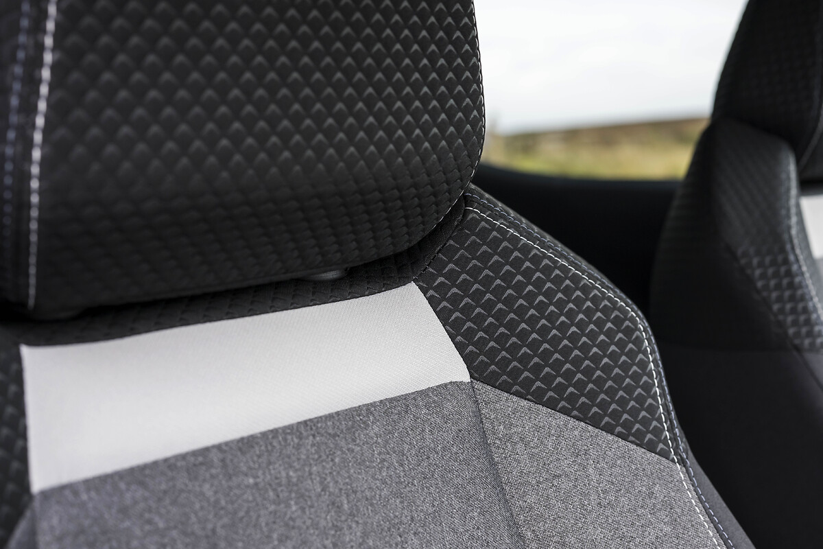 Close-up of front seat upholstery with quilted pattern